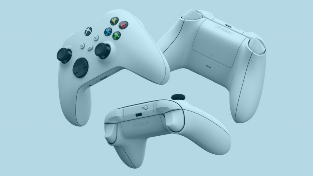 3 controles de Xbox Series S brancos flutuando.